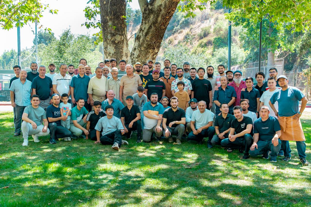 Uzbek community members gathered at a park event